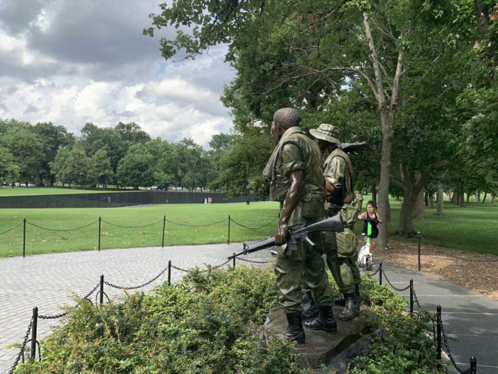 Image of the Three Servicemen Statue overlooking the Vietnam Memorial Wall, Washington, D.C.