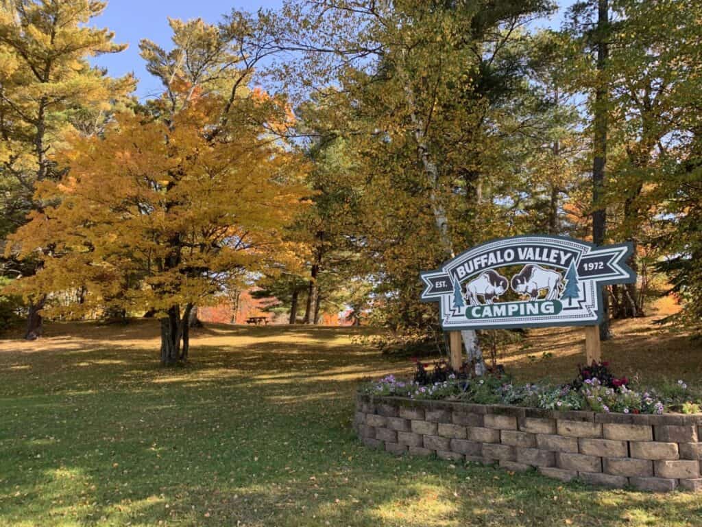 Image of Buffalo Valley Camping sign and landscape showing the fall color change.